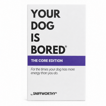 A white rectangular product box with bold black text reading 'YOUR DOG IS BORED' and a purple band that says 'THE CORE EDITION.' Smaller text reads 'For the times your dog has more energy than you do.