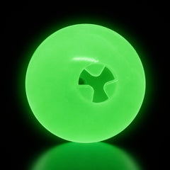 SodaPup 4-inch Glow Ball treat dispenser glowing green in the dark
