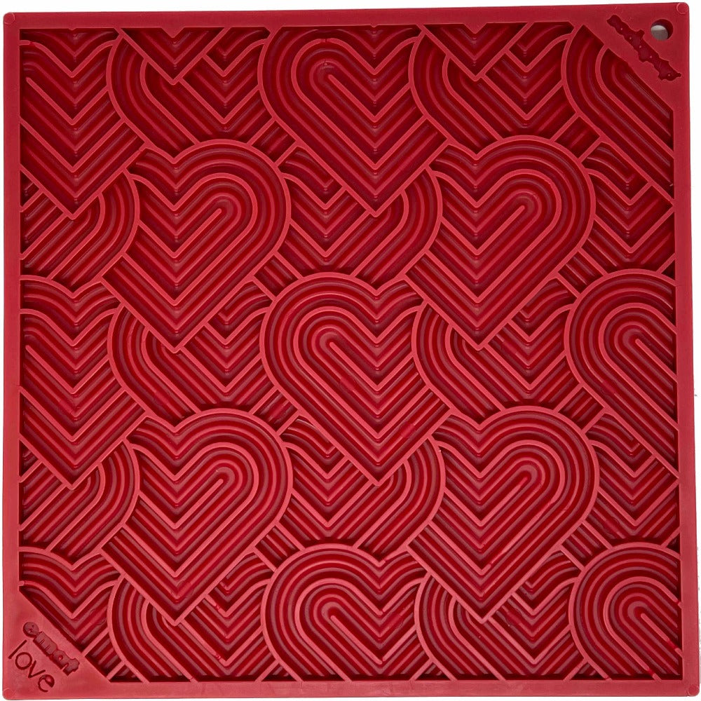 Large red SodaPup Love eMat lick mat with a heart pattern